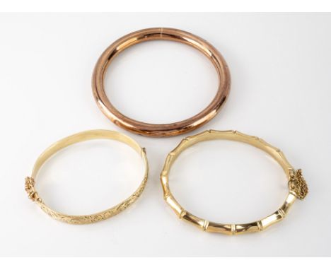 Two 9ct gold bangles, one bamboo style in yellow gold, the other plain ring form in rose gold; together with a rolled gold fo