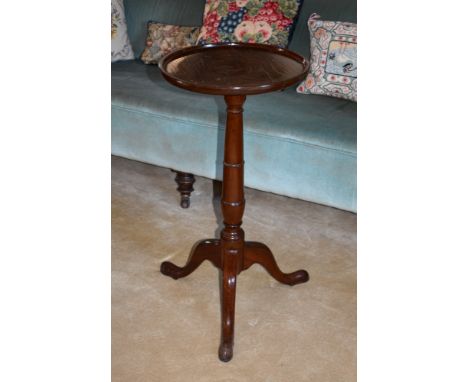 A 19th century mahogany tripod table, with circular dished top, ring turned column and cabriole legs with pad feet, 14¾in. (3