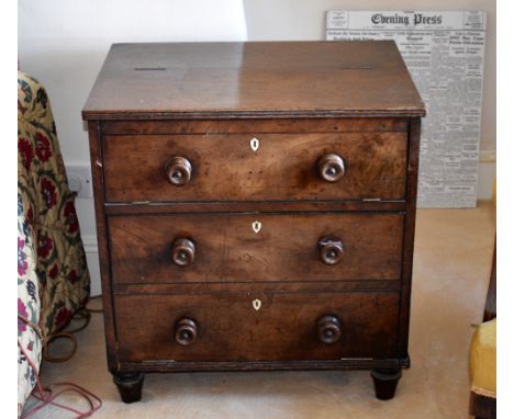 A George IV mahogany commode, converted, in the form of a small chest of drawers, with reeded edges, the top compartment bene