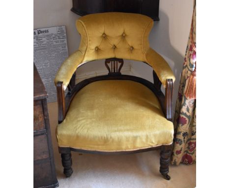 A late Victorian walnut tub armchair, the buttoned scroll back and curved arms raised on triple pierced lyre splats and reede
