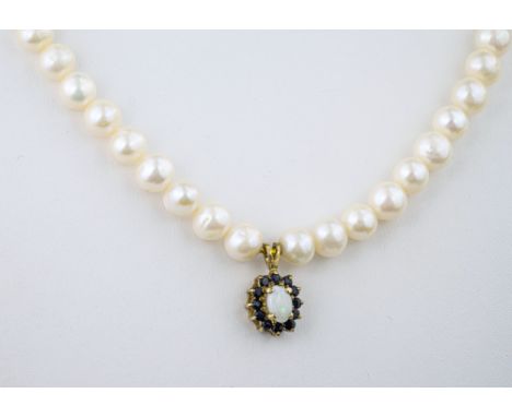 A 9ct gold, opal, sapphire and pearl necklace, the oval cabochon opal within a cluster of round cut sapphires, on a single st