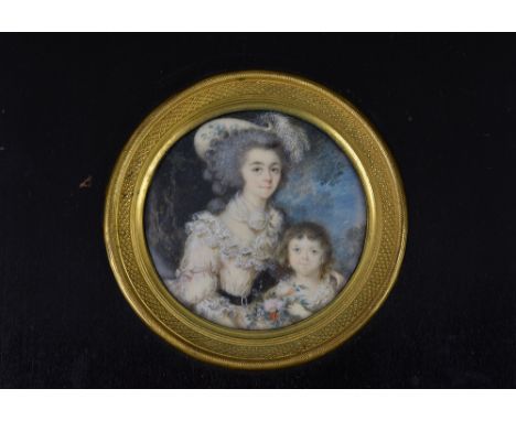 French School, 19th century - a portrait miniature of a mother and child, circular watercolour on ivory, the mother in low cu