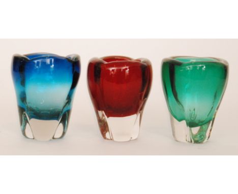 A Whitefriars glass molar vase designed by William Wilson, of tapering lobed form in ruby cased in clear crystal, together wi