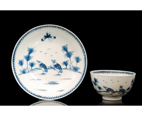 A late 18th Century Worcester blue and white teabowl and saucer decorated in the Two Quails pattern, painted crescent mark to