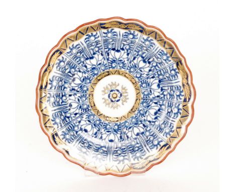 A late 18th to early 19th Century Worcester Royal Lily pattern fluted edge plate with panels of stylised floral decoration an