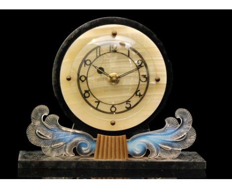 A 1930s Art Deco mantle clock in green onyx and black marble decorated with applied opalescent pressed glass foliate scrolls,