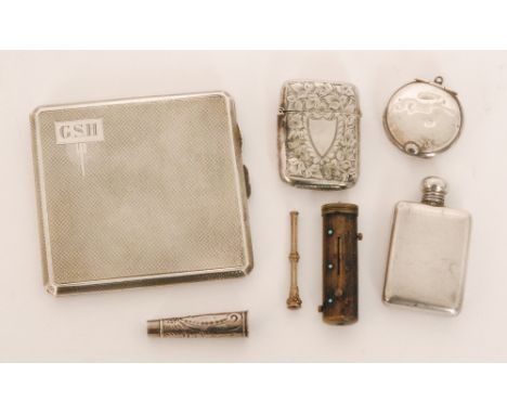 A George V hallmarked silver square engine turned cigarette case, Birmingham 1935, a brass cased etui with retractable tools 