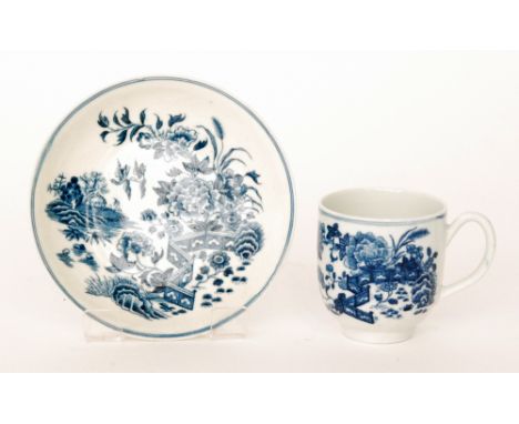 An 18th Century Worcester coffee cup and saucer decorated in the blue and white Fence pattern, both pieces with crescent mark