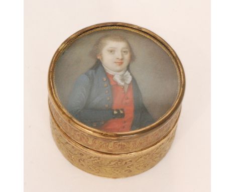 A late 18th to early 19th Century portrait miniature of a gentleman wearing a blue coat over a scarlet waistcoat with with hi