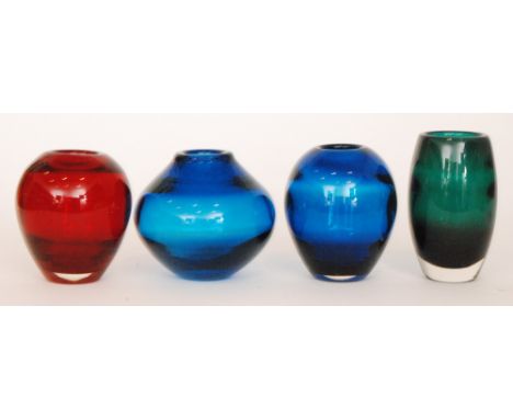 A group of post war Whitefriars optic ware crystal glass vases to include an example of barrel form in deep green, a shoulder