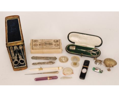 A small parcel lot of sewing related items to include a fitted wooden case sewing set, a scissor and thimble set in leather c