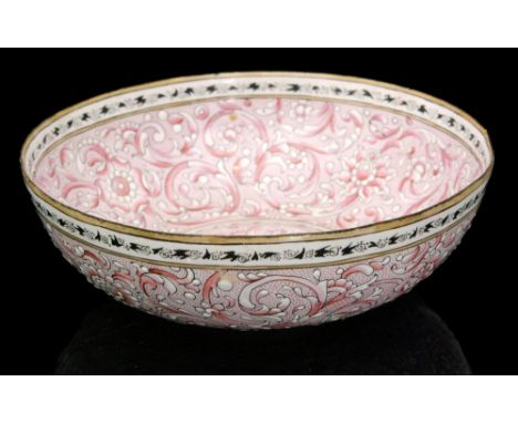 A 20th Century enamel bowl, with black and white banded borders upon a pink and white ground decorated with flower heads and 