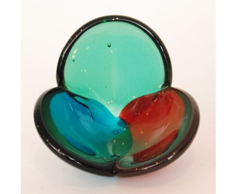 A post war Blenko glass bowl by Wayne Husted, of tri-lobed form in ruby, blue and green, acid marked, diameter 18cm.