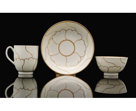 An 18th Century Worcester Gold Queen's pattern trio comprising tea bowl, coffee cup and saucer all decorated with a gilt styl