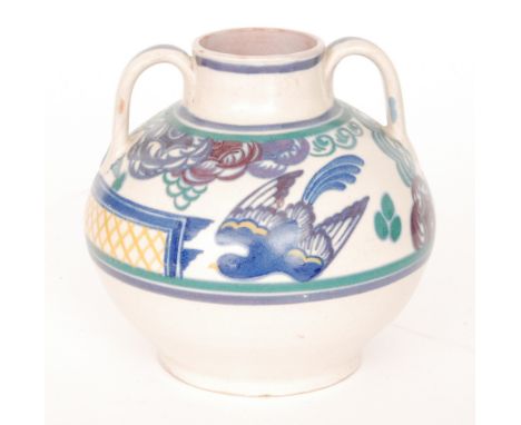 A Carter Stabler and Adams Poole Pottery twin handled shape 202 vase decorated in the PN pattern with a band of stylised flow