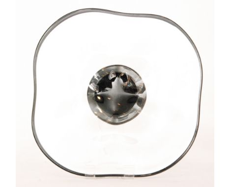 A 1930s Orrefors glass footed charger by Simon Gate, the black pad foot rising to a wide square form bowl in clear crystal wi