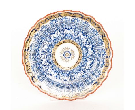 A late 18th to early 19th Century Worcester Royal Lily pattern fluted edge plate with panels of stylised floral decoration an
