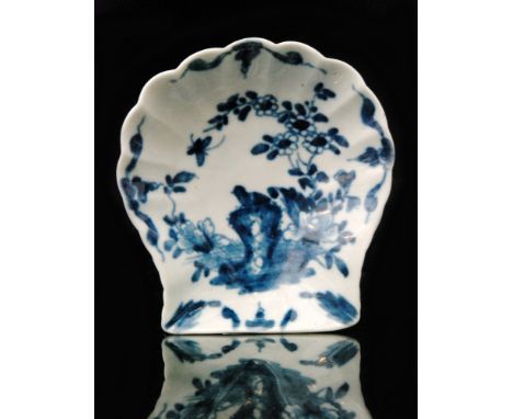 A late 18th Century Worcester scallop shell pickle dish decorated in the blue and white Two Peony Rock Bird pattern, the reve