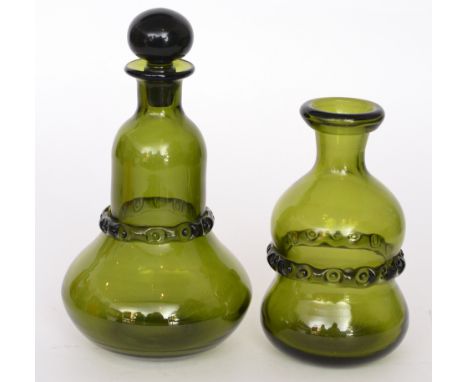 A post war Ekenas glass decanter by Onwar Lake, of low shouldered form with domed collar neck and spherical stopper, decorate