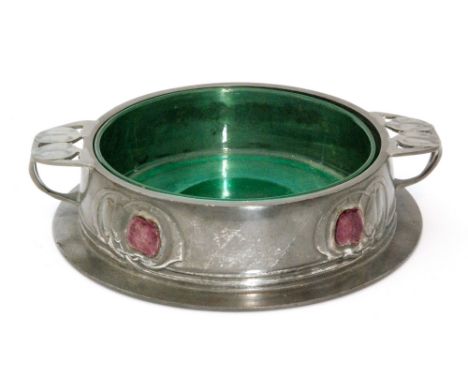 An early 20th Century English Pewter for Liberty & Co butter dish designed by Archibald Knox, the pewter base with purple ena
