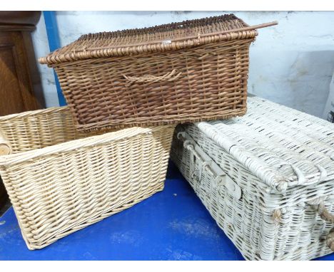 Three vintage wicker hampers and baskets including a lockable military/motoring example, width 76cm