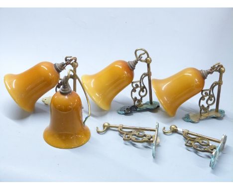 Four designer wall mounted light fittings and a spare bracket, by repute Christopher Wray