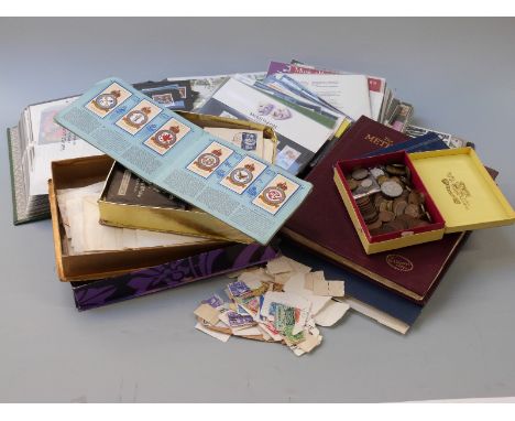 A box containing Great Britain presentation packs, first day &amp; loose covers, a Meteor album of all world stamps &amp; sun