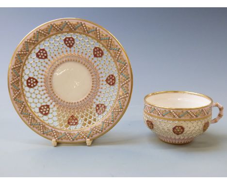 Royal Worcester reticulated enamelled and jewelled cup and saucer with fine gilt decoration on a pink and aqua ground, possib