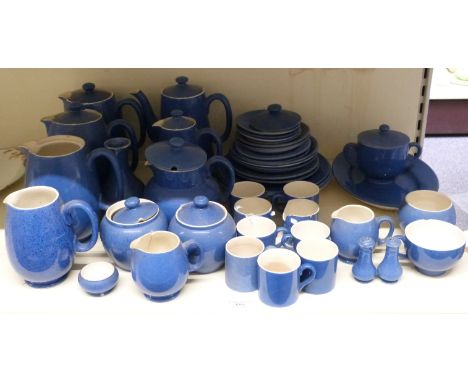 Moorcroft tea and coffee ware decorated in blue, includes multiple tea and coffee pots, jugs, sugars, cups, cruets, plates an