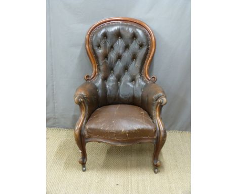 19thC mahogany upholstered button-back armchair with serpentine front and scrolling arms, raised on cabriole gnarled legs and