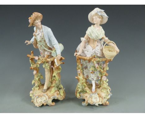 Pair of German ceramic figures of a lady and gentleman, 38cm tall