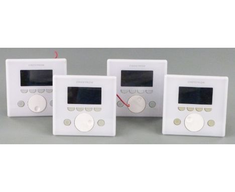 Four white Creston APAD wall mounted LCD controllers for Creston's Adagio home entertainment system, manual can be downloaded