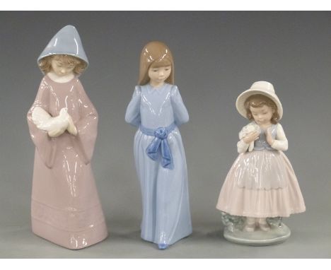 Three Nao figurines, tallest 26cm