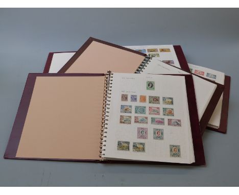 An extensive collection of Commonwealth Queen Elizabeth II stamps in 38 Stanley Gibbons universal stamp albums together with 