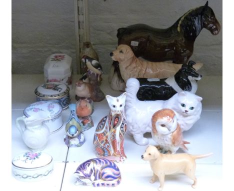 A collection of Beswick, Royal Worcester and Royal Crown Derby bird and animal figures
