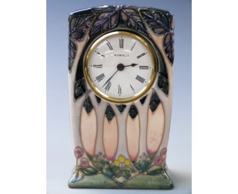 Moorcroft clock with tube lined decoration of trees, 16cm tall