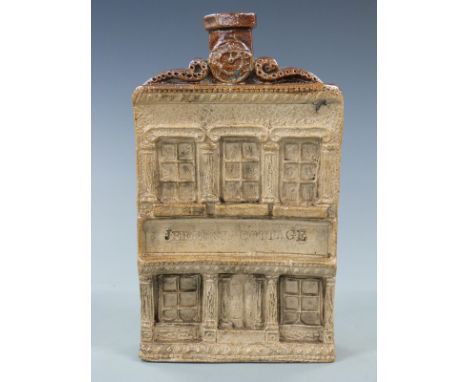 A 19thC salt glazed Reform flask in the form of a pub or house, with relief moulded decoration and entitled Jeffery's Cottage