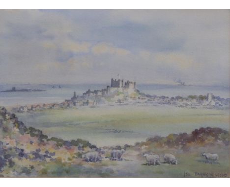 Frank W Wood (1905-1985) watercolour Banburgh Castle in a seascape with sheep in the foreground, 25.5 x 36cm&nbsp;