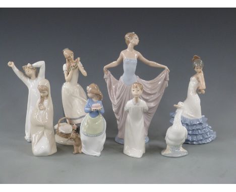 A collection of Lladro, Nao and a similar figures, some boxed, tallest 28cm