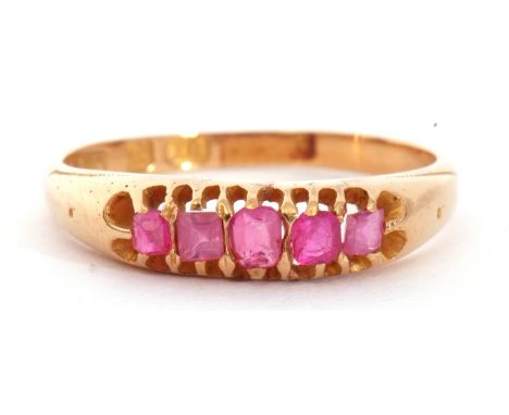 Victorian 18ct gold ruby five stone ring, featuring five mixed cut small rubies, line set in a pierced gallery, size L