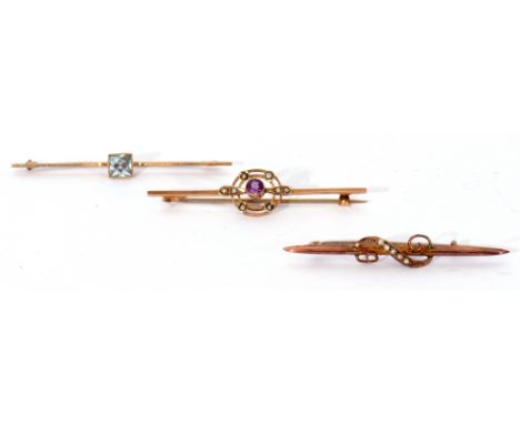 Mixed Lot: 9ct stamped amethyst and seed pearl set open work brooch, an antique aquamarine set brooch, box and millegrain set