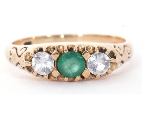 Modern 9ct gold paste set ring centring a green coloured stone between two pastes