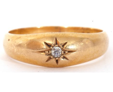 Early 20th century 18ct gold and diamond single stone gipsy ring, centring an old brilliant cut diamond in a star engraved se