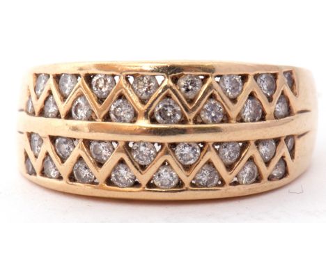 Modern diamond set ring featuring four pierced rows of small diamonds between triangular settings, stamped 14kt, size R, 5.7g