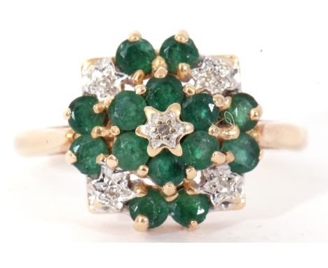 Modern yellow metal diamond and emerald cluster ring, a flowerhead design, all set and raised in a basket mount (unmarked), s