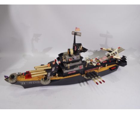 Topper Toys - An unboxed battery operated 'USS Battlewagon' from Topper Toys. The vintage plastic warship measures approximat