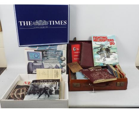 A mixed lot to include vintage sheet music, military related publications, various ephemera, black and white photographs, a b