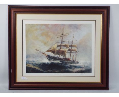 A large print depicting a sailing ship, signed in pencil by the artist to the margin, titled RRS Discovery  At Sea, mounted a
