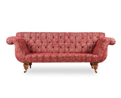 
	
		A VICTORIAN WALNUT AND RED UPHOLSTERED SOFA
		CIRCA 1850
		Of U-shape, with button upholstered back above facetted feet 