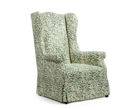 
	
		A GREEN 'BAMBOO' PATTERN UPHOLSTERED WING ARMCHAIR IN GEORGE II STYLE
		EARLY 20TH CENTURY
		103cm high, 74cm wide, 72cm